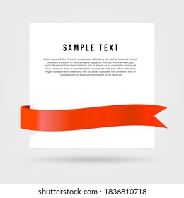 White paper card with red ribbon.