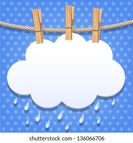 White paper cloud hanging by clothes peg on a clothesline