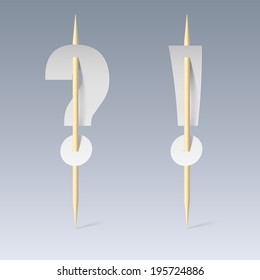 White paper cut font on toothpicks on grey background. Question and exclamation marks