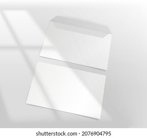 White paper envelope on a table with light of the window shadow overlay. Realistic vector mockup with sun flare effect 