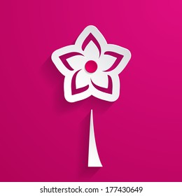 white paper flower on the pink background