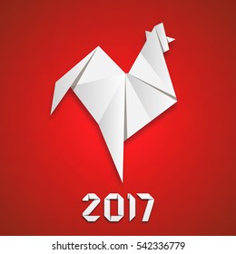 White paper folded rooster handmade origami. holiday greeting card. Happy new year 2017