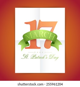 White paper folded sheet showing glossy text of 17 March for Happy St. Patrick's Day celebration, can be used as template, brochure or flyer.