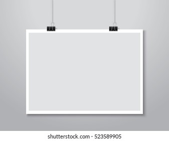 white paper hanging on background.