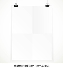 White paper hanging on two binders isolated on a white background