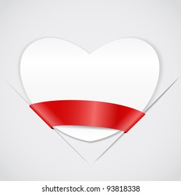 White paper heart with red ribbon