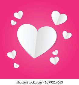 white paper heart shape on pink background for card and website decoration. love and care concept