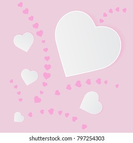 white paper hearts Valentines day card on pink background.