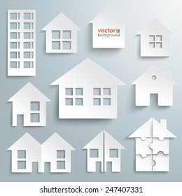 White paper houses set on the gray background. Eps 10 vector file.