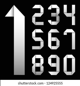 White paper origami number on black