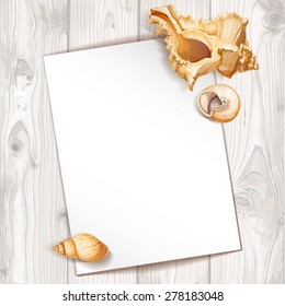 White paper pinned realistic seashells on a background of wood texture