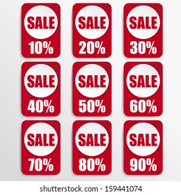 white paper and red paper discount labels