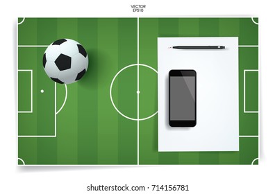 White paper sheet and blank smartphone with soccer football ball and soccer field background. Vector abstract background.