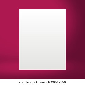 White paper sheet Standing in the red lit room on the table. Template mock up for display of product or your content. Business background.