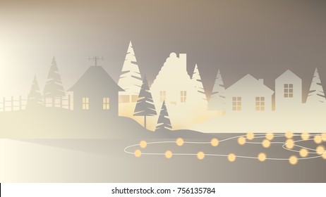 White paper village, houses with pine tree on the hill decorated with glowing Christmas lights