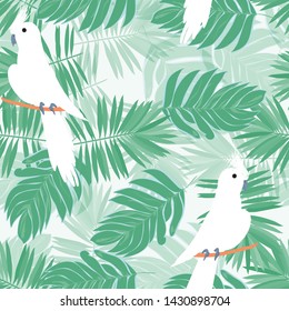 White parrot pattern with tropical leaves. Tropical seamless background with parrot, tropical leaves and hibiscus flowers. Beautiful black Corella