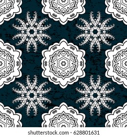 White pattern on blue background with white elements. Ornate vector decoration. Seamless damask pattern background for wallpaper design in the style of Baroque.