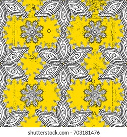 White pattern on yellow background with white elements. Ornate vector decoration. Seamless damask pattern background for wallpaper design in the style of Baroque.
