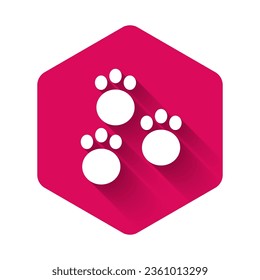 White Paw print icon isolated with long shadow. Dog or cat paw print. Animal track. Pink hexagon button. Vector