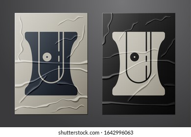 White Pencil sharpener icon isolated on crumpled paper background. Paper art style. Vector Illustration