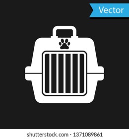 White Pet carry case icon isolated on black background. Carrier for animals, dog and cat. Container for animals. Animal transport box. Vector Illustration