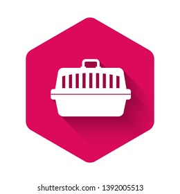 White Pet carry case icon isolated with long shadow. Carrier for animals, dog and cat. Container for animals. Animal transport box. Pink hexagon button. Vector Illustration