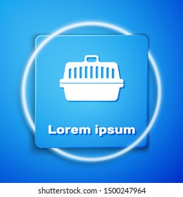 White Pet carry case icon isolated on blue background. Carrier for animals, dog and cat. Container for animals. Animal transport box. Blue square button. Vector Illustration