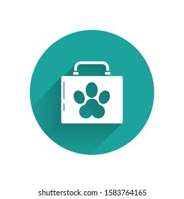 White Pet first aid kit icon isolated with long shadow. Dog or cat paw print. Clinic box. Green circle button. Vector Illustration