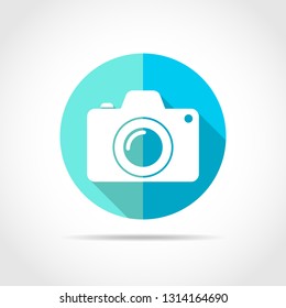 White photo camera in flat design with long shadow. Vector illustration. Simple photo camera icon on blue round button.
