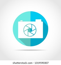White photo camera in flat design with long shadow. Vector illustration. Simple photo camera icon on blue round button.