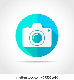 White photo camera in flat design with long shadow. Vector illustration. Simple photo camera icon on blue round button.