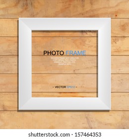 White photo frame on wooden texture background - Vector illustration