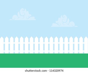 White picket fence with cloudy sky