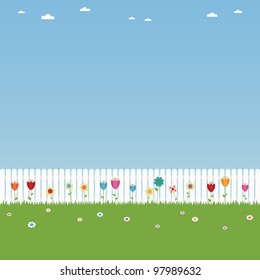 white picket fence landscape with flowers and copy space