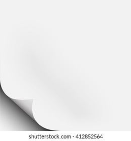 White piece of paper with corner fold, curl with shadow. Light from upper right.