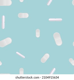 White pills on a colored background. Pattern.