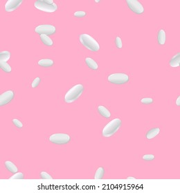 White pills on a colored background. Pattern.