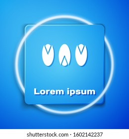 White Pistachio nuts icon isolated on blue background. Blue square button. Vector Illustration