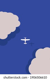 White plane flies over the sea surrounded by clouds with shadow falling on blue water