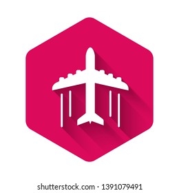 White Plane icon isolated with long shadow. Flying airplane icon. Airliner sign. Pink hexagon button. Vector Illustration