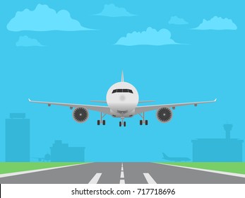 White plane landing on runway. Airport buildings background