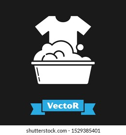 White Plastic basin with soap suds icon isolated on black background. Bowl with water. Washing clothes, cleaning equipment.  Vector Illustration