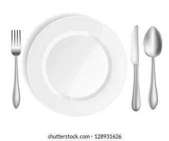 white plate with knife,spoon and fork