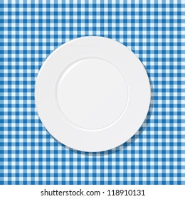 White Plate On Blue Tablecloth