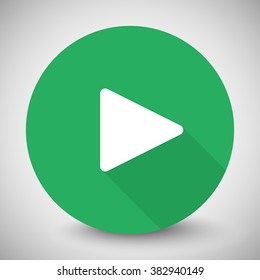 White Play icon with long shadow on green circle