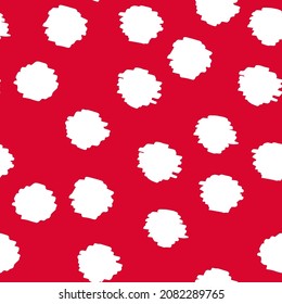 White polka dot abstract seamless pattern on a red background. Vector design for textile, backgrounds, clothes, wrapping paper, web sites and wallpaper. Fashion illustration seamless pattern.