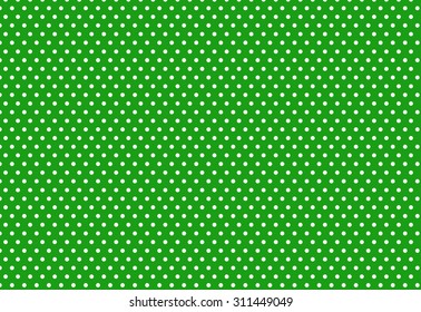 white polka dot on green background