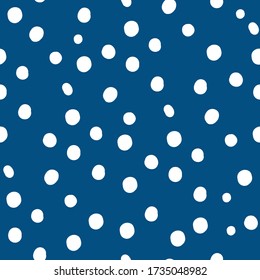 White Polka Dot Pattern with pantone color of the year classic blue background. Seamless repeat pattern. Stylish repeating texture.