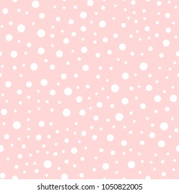 White polka dots seamless pattern on pink background.