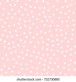 White polka dots seamless pattern on pink background.